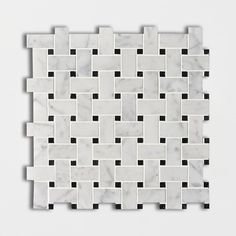 a white marble tile with black squares on it