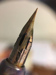 a fountain pen sitting on top of a table