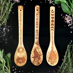 three wooden spoons with different designs on them