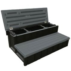 two black plastic storage boxes sitting side by side on top of each other with lids open