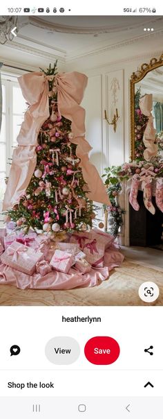 a christmas tree with pink bows on it