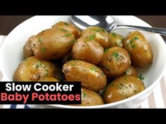 a bowl filled with baby potatoes on top of a table