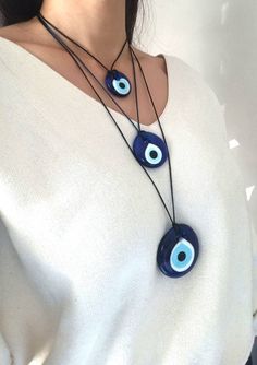 Glass Evil eye necklaces are adjustable. You can easily adjust the lenght of the nazar necklace. Blue evil eye beads are 35 mm(1.37 in) 45 mm(1.77 in) and 55 mm(2.16 in) Evil Eye pendant is made of glass. This Turkish Eye Jewelry is great for daily wear. It would also be the perfect amulet gift. Please choose the longest lenght and the cord color of the necklace you prefer during check-out. For more evil eye necklaces, click the link below; https://www.etsy.com/shop/EyeDesignsbyGG?ref=search_sho Adjustable Evil Eye Round Pendant Necklace, Adjustable Evil Eye Amulet Necklace, Adjustable Evil Eye Spiritual Necklace, Adjustable Spiritual Evil Eye Necklace, Evil Eye Jewelry Necklace, Nazar Necklace, Evil Eye Choker, Glass Evil Eye, Necklace Evil Eye