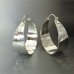 "Dazzling they are with their mirror shiny hammered finish, extra large hammered argentium sterling silver hoop earrings. With apx. 1300 hammer strikes to give this pair its wonderful finish and painstakingly polished to a brilliance this is the pair that you wear when you definitely want to be noticed. Although we've never used the word bling to describe our jewelry and we won't start today we will just say this is the pair you wear when you need some serious ZING! Argentium sterling is a tiny Chunky Silver Jewellery, Silver Statement Jewelry, Hoops Silver, African Earrings, Earrings Big, Funky Jewelry, Jewelry Lookbook, Sterling Silver Hoop Earrings, Large Earrings