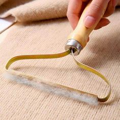 someone using a pair of scissors to cut fabric