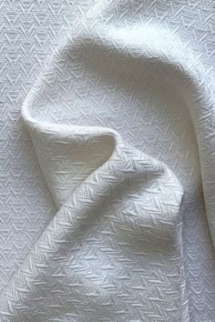 the white fabric is very soft and has an interesting pattern on it's surface