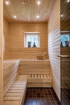 a wooden sauna with benches and windows