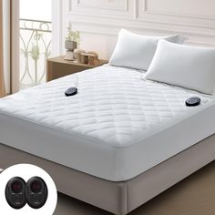 an image of a mattress with two buttons on it in the middle of a room