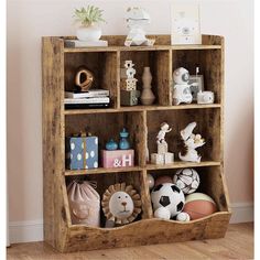 a wooden shelf filled with lots of toys