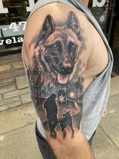 a man with a wolf tattoo on his arm