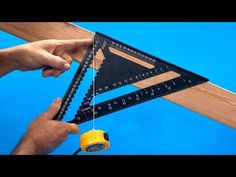 a man is measuring the height of a triangle with a tape measure