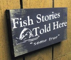 a sign that says fish stories told here some true