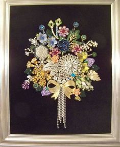 a bouquet of flowers in a silver frame