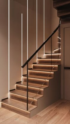 a staircase with wooden steps and white walls