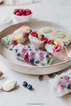 some fruit and yogurt rolls on a plate