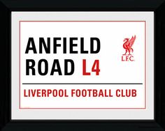 anfield road sign with the liverpool football club in red and white on black background