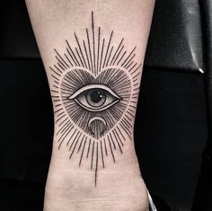 an all seeing eye tattoo on the arm