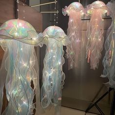 some jellyfish lights are hanging from the ceiling