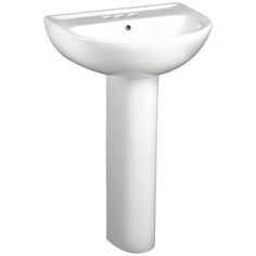 a white pedestal sink sitting on top of a counter