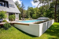 a swimming pool in the middle of a yard