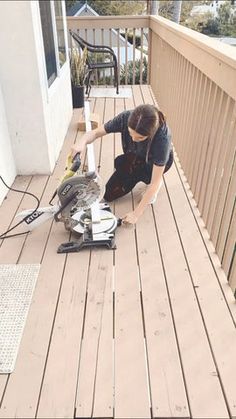 a person on a deck with a bird in the air and wires attached to it