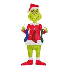 an inflatable christmas decoration with a grin face and green legs, wearing a santa hat