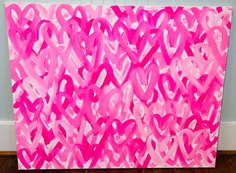 a pink painting with hearts painted on it