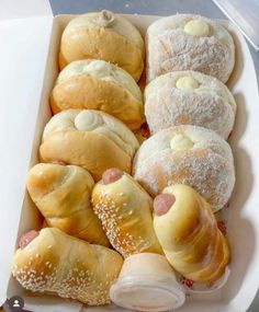 a box filled with lots of different types of pastries