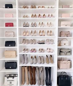 a white closet filled with lots of shoes and handbags on top of shelving units