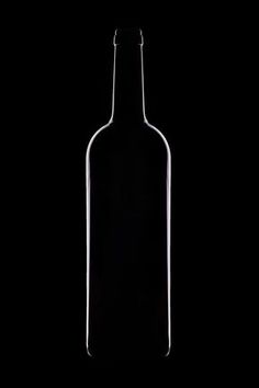 an empty bottle on a black background