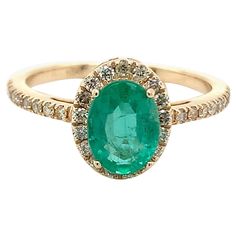 Oval cut Emerald gemstone beautifully crafted in a 10K yellow gold ring with natural diamonds. With a vibrant green color hue. The birthstone for May is a symbol of renewed spring growth. Explore a vast range of precious stone Jewelry in our store. Centre stone is an oval shape emerald with 1.10 carat weight & approx measurement - 8.00X6.00X3.80 mm. Diamond enhancing the beauty of ring weighs 0.27 cts. Explore more variety of Sapphires, Emeralds & Rubies in our store available as a loose gemstone that can be made & customize into this particular design or a bespoke jewelry piece of your choice. Oval Yellow Gold Halo Ring Gia Certified, Heirloom Oval Green Emerald Ring, Heirloom Oval Emerald Ring Gia Certified, Heirloom Oval Gia Certified Emerald Ring, Gia Certified Oval Diamond Ring In 14k Gold, Gia Certified Oval Green Diamond Ring, Oval Emerald Ring In Yellow Gold With Prong Setting, Oval Emerald Ring In Yellow Gold With Halo Setting, Oval Emerald Cluster Ring With Halo Design