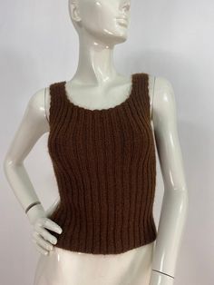 "Brown knit tank, knit tank top, fits like a women's size small, please verify exact measurements below Measurements:  Shoulder (outer seam-seam)11\"/bust(pit-pit)13\"(stretches several inches)bottom width 12\"-20\"/length 19\" Mannequin measurements:  5'8\", bust 34\", waist 25\", hip 33\" Please note that vintage clothing sizes can vary greatly.  The Measurements provided  are approximate and are taken lying flat.  I suggest taking a similar garment from your wardrobe and measure it while lying flat.  This way you can compare measurements.   Don't forget to enlarge the photos and take a closer look at this genuine vintage item!! I will ship your item off within 1-2 business days. I ship expedited for all Canadian and US orders. All other destinations world wide will be shipped surface an Knit Tank Top, Knit Tank, Knitted Tank Top, Knit Tanks, Womens Tank, Vintage Clothing, Womens Clothing Tops, Dream Closet, Don't Forget