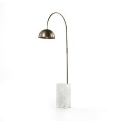 a floor lamp with a marble block base