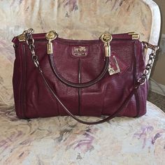 Beautiful Coach Bag In Deep Red. In Really Good Condition. There Are A Couple Of Flaws On Each Side Of The Bag That Are Pictured. 14 L 9 H 5 D Burgundy Satchel Shoulder Bag With Gold-tone Hardware, Burgundy Travel Bags With Gold-tone Hardware, Burgundy Satchel Bag With Gold-tone Hardware, Luxury Burgundy Coach Bag, Coach Burgundy Satchel For Travel, Burgundy Tote Satchel With Gold-tone Hardware, Burgundy Satchel Tote With Gold-tone Hardware, Burgundy Satchel With Gold-tone Hardware, Burgundy Bags With Gold-tone Hardware And Double Handle