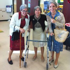 three women standing next to each other with crutches and canes in their hands