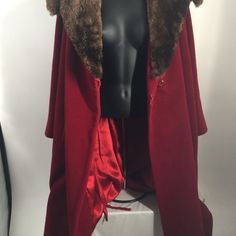 Item Description: Beautiful 1950s Red Velour W/Faux Fur Collar Swing Coat Designed By Louis Workman Brand: Forstmann Fleur De Lis By Louis Workman Made For The Joseph Horne Co. Size Listed: N/A Gender: Women Top Sizing: Chest= 46" Length= 30" Sleeve= 22" Fitted Outerwear For Christmas Costume Party, Fitted Winter Cape For Costume Party, Vintage Winter Outerwear For Costume Party, Fitted Fall Cape For Costume, Fitted Cape For Fall Costume, Fitted Cape Outerwear For Costume Party, Fitted Cape For Costume Party, Fitted Cape For Costume, Winter Season, Christmas Formal Fitted Outerwear