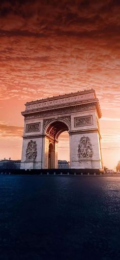 an image of the arc de trioe at sunset