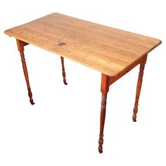 an old wooden table with two legs and a small piece of wood on the top