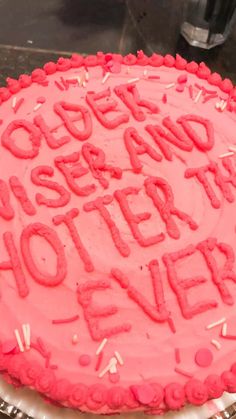 a pink cake with red frosting and sprinkles that says, go get and see better together forever