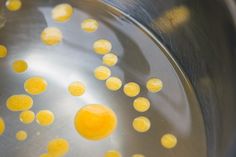 some yellow food is being cooked in a frying pan