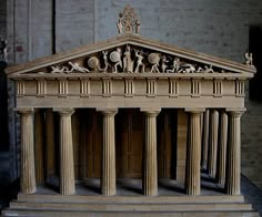 a model of an old building with statues on it