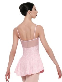 a woman in a pink leotard with her back to the camera