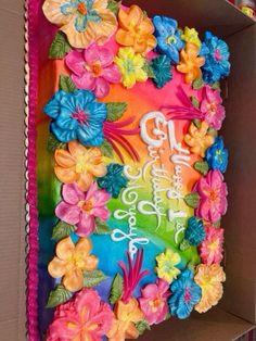 an open box with flowers on it and the words happy birthday written in large letters