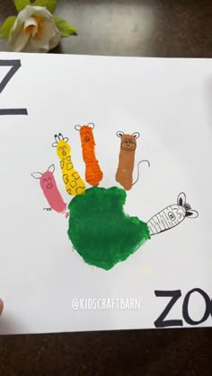 a child's handprint with animals on it and the letter z is for zoo