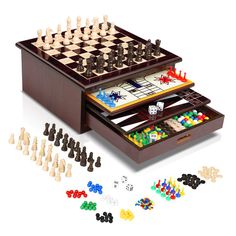 a wooden chess set sitting on top of a table next to pieces of game board