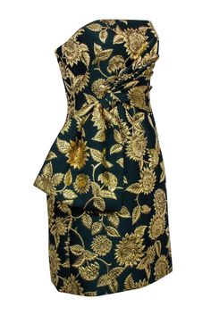 Set the holiday season ablaze in this gorgeous Lela Rose strapless mini dress! Featuring a beautiful green and gold floral jacquard, you can style this showstopper to your next gala with chic pumps and a sleek clutch to turn heads. Ready, set, sparkle! Size 6 Shell 80% Polyester, 11% Polyamide, 9% Metallized Polyester Lining 100% Polyester Invisible back zipper Strapless bodice Side bow detail Bust 36" Waist 34" Length 27.5" Luxury Green Jacquard Dress, Luxury Strapless Floral Print Dress, Fitted A-line Jacquard Mini Dress, Luxury Jacquard Mini Dress, Floral Jacquard Mini Dress, Lela Rose Dress, Buy Shoes Online, Lela Rose, Modern Lifestyle