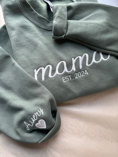 THIS WILL BE EMBROIDERY ON THE SWEATSHIRT ♥TO ORDER♥ ADD YOUR PERSONALIZATION BELOW Customize this shirt with mama, meme, nana etc.. Add your Est date and then add the kids name on the sleeve (heart will also be on the sleeve as shown below.) Just list them in the personalization area when ordering. Select your Sweatshirt Color from the chart Dark Colored shirts will have Ivory or White Thread Light Color Shirts will have Black or Gray Thread Please make sure to add a phone number and email at c Meme Nana, Mama Meme, Mama Embroidered Sweatshirt, Mama Sweatshirt, Embroidered Sweatshirt, Embroidered Sweatshirts, Kid Names, The Kids, Baby Stuff