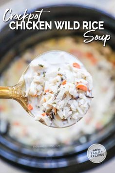 a spoon full of chicken wild rice soup in a crock pot with text overlay