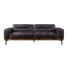 a black leather couch sitting on top of a wooden frame