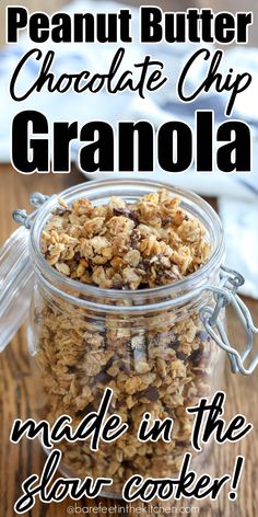 a jar filled with granola on top of a wooden table